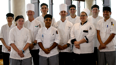 group of chefs wearing white chef coat