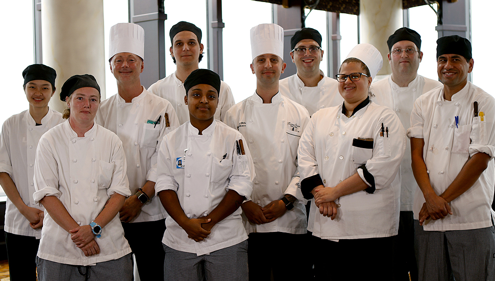 group of chefs wearing white chef coat