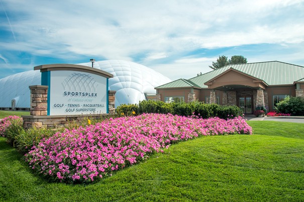 Flower lined entrance to the Sportsplex for golf, tennis, and racquetball at Turning Stone