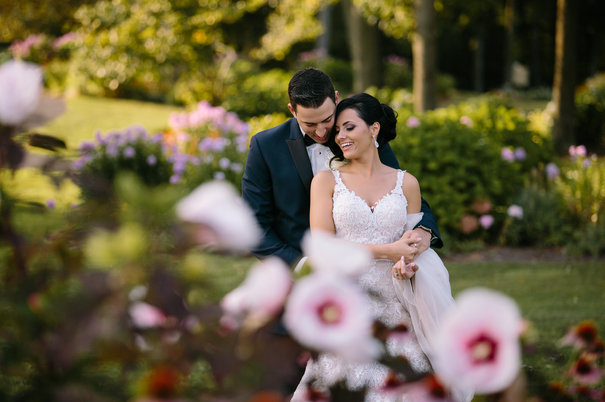 Bride and groom embrace at Turning Stone wedding venue