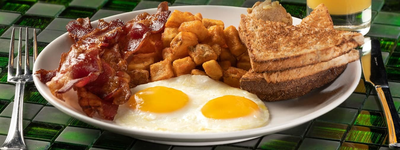 Eggs, hash browns, bacon, and toast