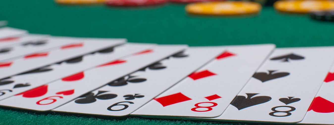 Playing cards on gaming table inside The Poker Room at Turning Stone Casino
