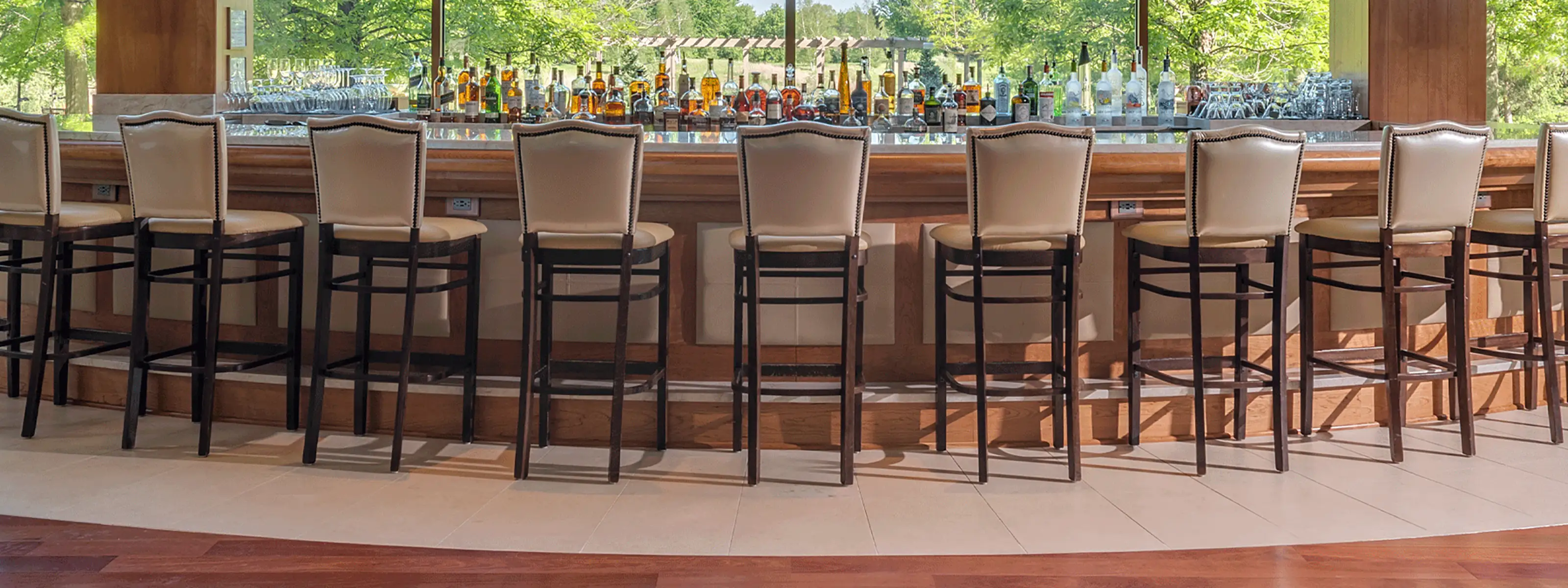 The bar in The Lodge Lounge looking over beautiful natural landscape