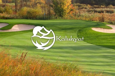 Morning sun shining on the Kaluhyat golf course through the woods