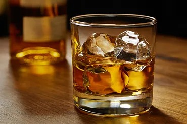Glass of whiskey with ice