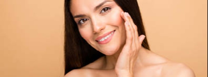 Woman touching her cheek and smiling