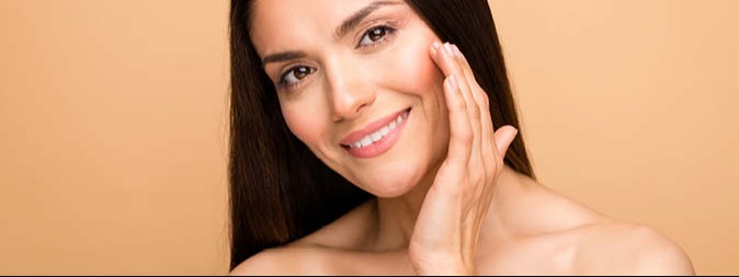 Woman touching her cheek and smiling