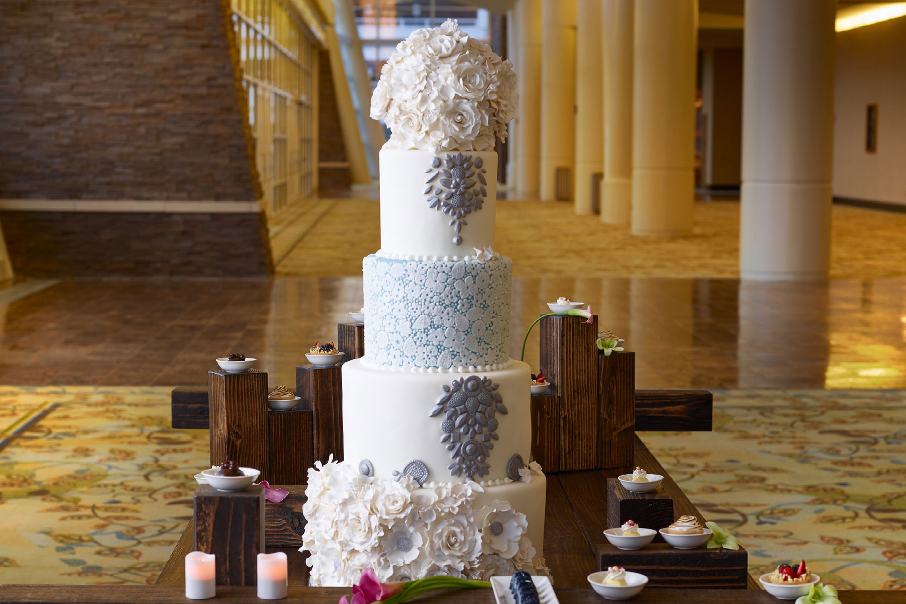 White Wedding Cake decorated with blue flowers