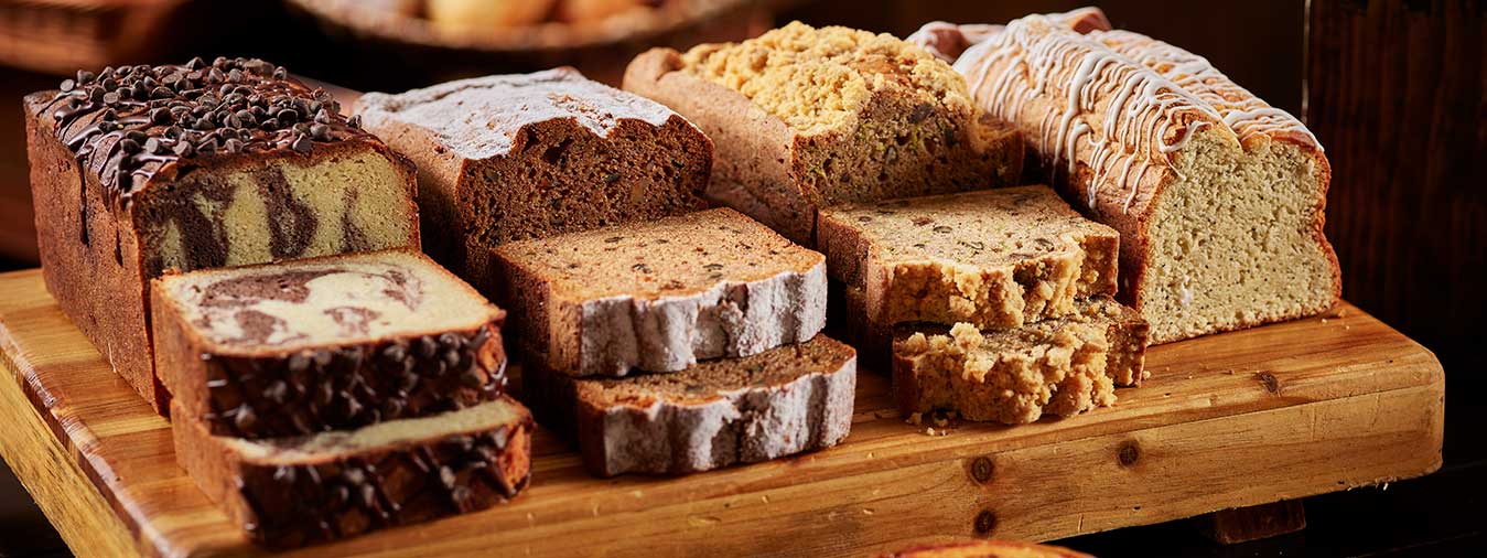 Assorted baked breads including coffee bread and banana bread at Opals Bakery