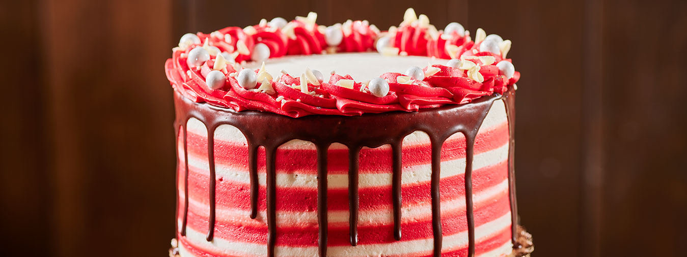 Red velvelt birthday cake served at Opals Bakery