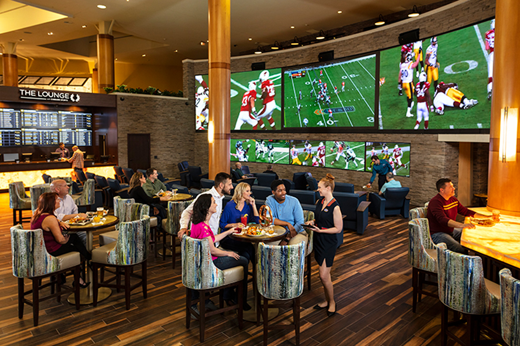 A crowd enjoying appetizers at The Lounge Sportsbook in Verona, NY