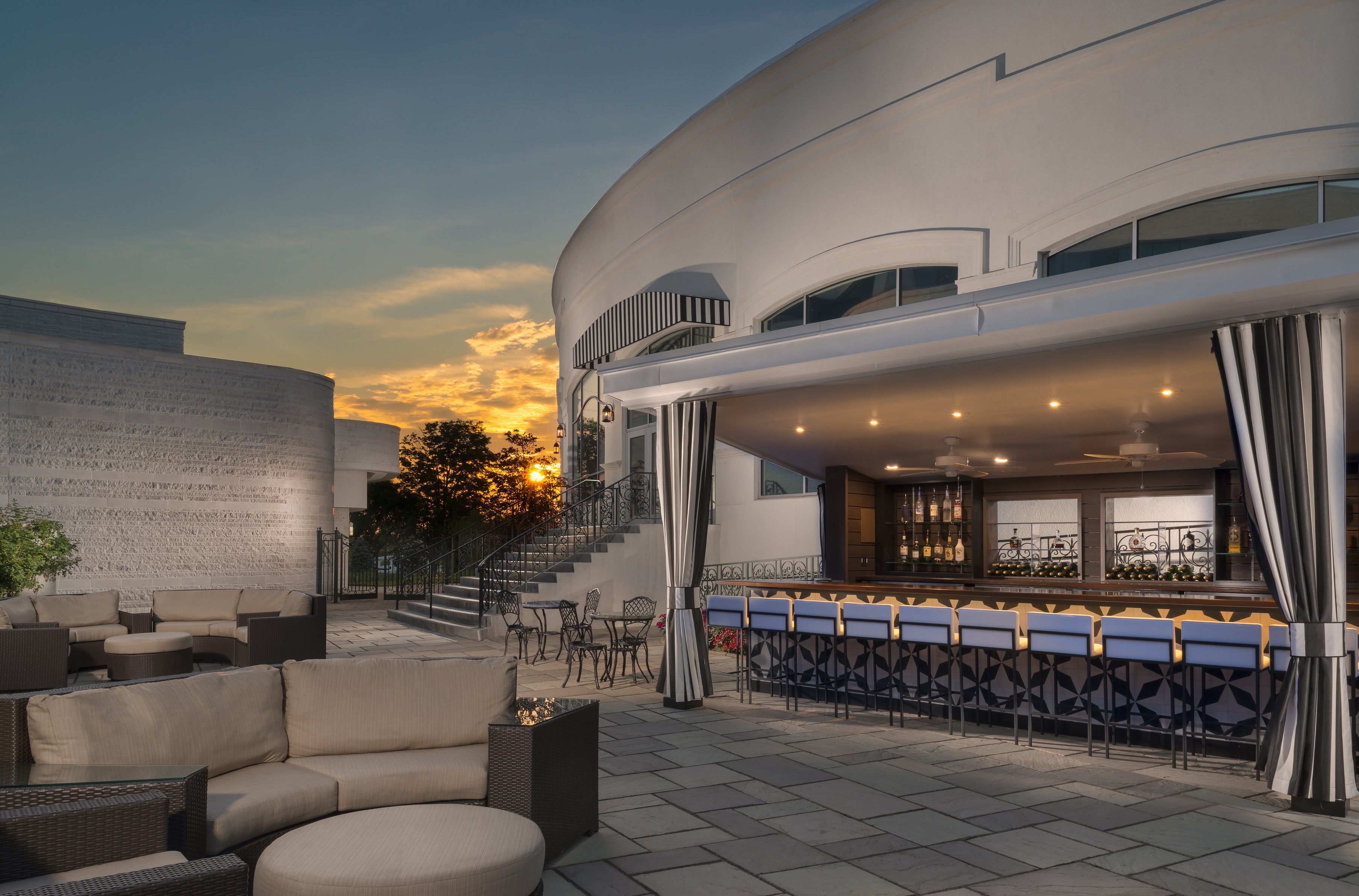 Sun sets on Crescent Courtyard outdoor patio bar and performance space