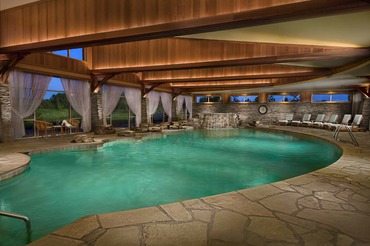 Indoor pool with rock waterfall at The Lodge 