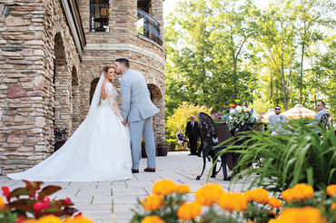 Bride and Groom posing on the Shenendoah Clubhouse Patio